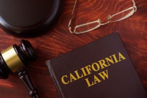 Book with title California law and a gavel.